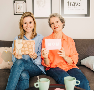 Older-DaughterMother-Holding-Signs-for-Mothers-Day